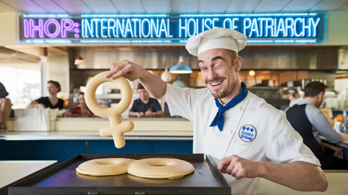 A 1950s-style diner with a neon sign reading "IHoP: International House of Patriarchy" featuring a winking male chef flipping a Venus symbol-shaped pancake, traditional gender roles