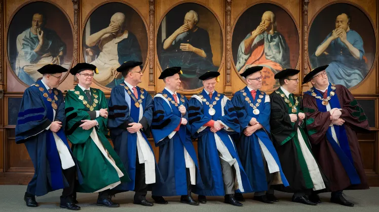 Oxford TikTok controversy, A line of Oxford dons in full academic regalia attempting to do the "Oxford Scholarly Shimmy" while ancient portraits in the background appear to be averting their eyes in shame