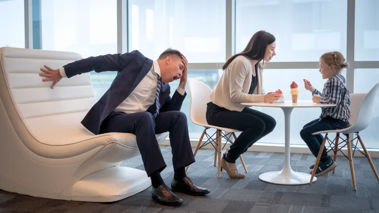 child development technique, A luxury "child listening consultant" dramatically fainting onto a $5,000 ergonomic fainting couch while watching a parent and child having a simple conversation over ice cream]